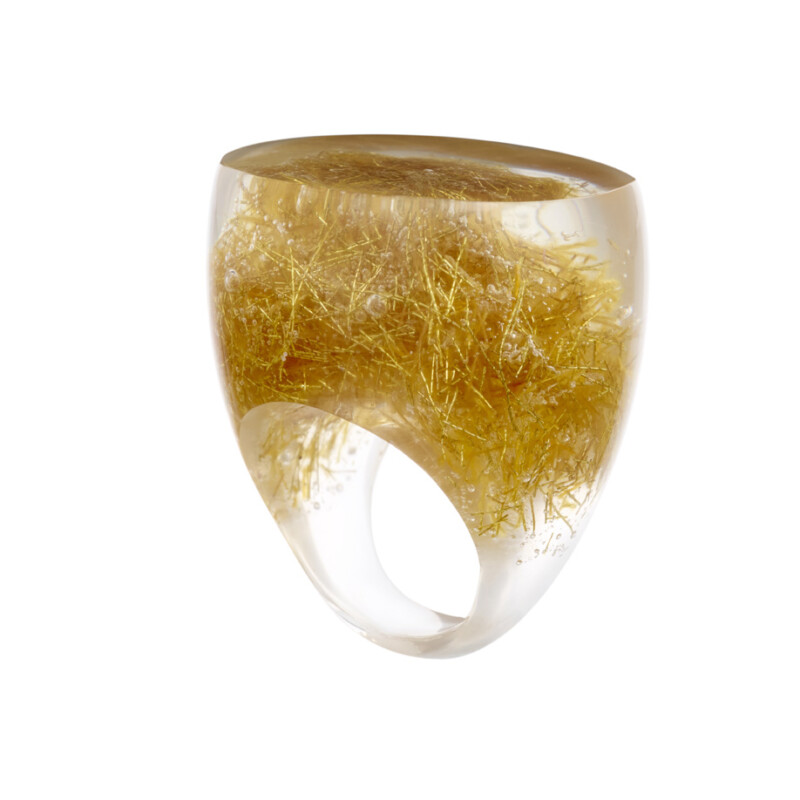 Statement ring in emperor's gold composiet.